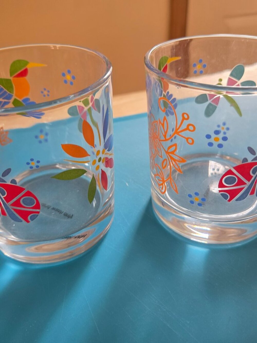 temptation's glasses hummingbirds/flowers set of two well made very pretty